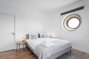 Cama ou camas em um quarto em GuestReady - Casas de Fralães 1
