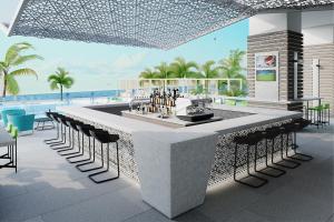 a rendering of a bar in a resort with the ocean at Renaissance Daytona Beach Oceanfront Hotel in Daytona Beach