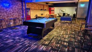 a billiard room with a pool table in it at Trademark Hostel Sydney in Sydney