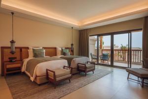 Postel nebo postele na pokoji v ubytování Naama Beach Villas & Spa + 37 fotografií