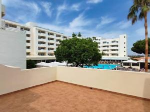 a view from the balcony of a hotel with a pool at Albufeira Sol Villas III by Stay ici in Albufeira