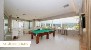 a living room with a pool table in it at Apartamento Barra da Tijuca in Rio de Janeiro