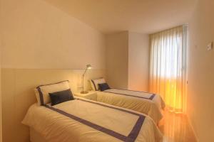 Posteľ alebo postele v izbe v ubytovaní 1092 marbella old town