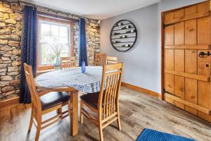 a dining room with a table and chairs at Host & Stay - Lime Tree House in Holme +13 photos