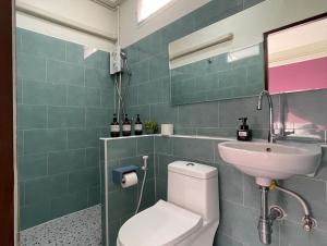 a bathroom with a white toilet and a sink at Self check-in apartment by Baiput Hometel in Phra Nakhon Si Ayutthaya +37 photos