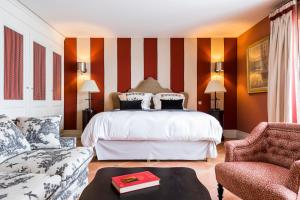 Cama ou camas em um quarto em Les Clefs de Troplong Mondot