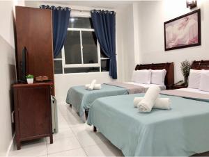 Кровать или кровати в номере Saigon Cozy2 Hotel