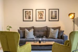 a living room with a couch and a table at Alba Spacious Maisonette in Corfu