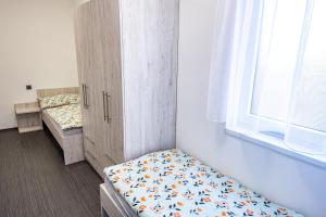 Voodi või voodid majutusasutuse Penzion Fann toas