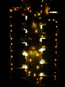 an overhead view of a city at night at POUSADA ZAYA in São Miguel dos Milagres