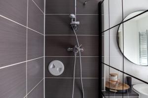 a bathroom with a shower with a sink at GuestReady - Paradise Break in Brighton in Brighton & Hove