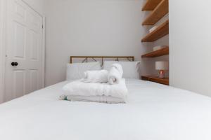 Кровать или кровати в номере GuestReady - Uma joia escondida em Brighton