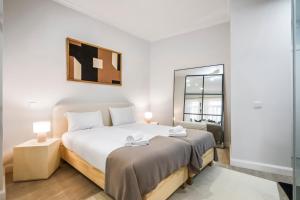 En eller flere senge i et værelse på Ponte Nova Studios