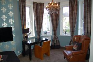 TV a/nebo společenská místnost v ubytování Boutique-Hotel GEORGES