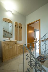 a bathroom with a sink and a mirror at Zoe's Place - 2 BD Beachfront Apartment in Kissamos +46 photos