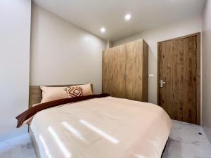 Ένα ή περισσότερα κρεβάτια σε δωμάτιο στο NINE HOUSING 279 Doi Can +3 φωτογραφίες