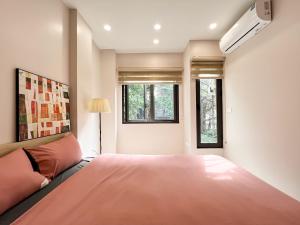 Ένα ή περισσότερα κρεβάτια σε δωμάτιο στο NINE HOUSING 279 Doi Can