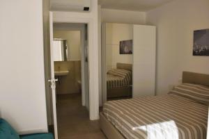 Ένα ή περισσότερα κρεβάτια σε δωμάτιο στο Residenza Le Sorelle - Mara
