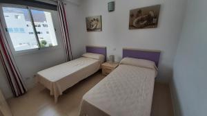 Posteľ alebo postele v izbe v ubytovaní 2BR Home - 3 min to Agaete Beach - Pool + 7 fotografií