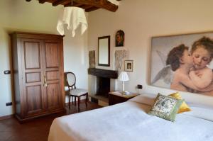Postel nebo postele na pokoji v ubytování Agriturismo Il Caggio