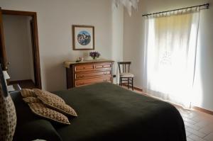 Postel nebo postele na pokoji v ubytování Agriturismo Il Caggio