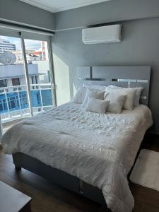 En eller flere senge i et værelse på Ejecutivo penthouse en santo domingo