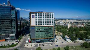 an aerial view of a tall building in a city at Novotel Sofia in Sofia