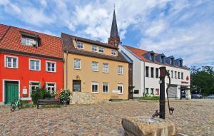 a group of buildings in a town with a church at 2 Bedroom Stunning Apartment In Burg Stargard in Burg Stargard