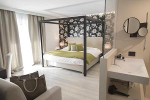 Postel nebo postele na pokoji v ubytování Hotel San Giacomo Spa&Gourmet