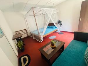 a room with a bed with a net at Moon Bay in Mirissa +108 photos