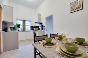 a kitchen and dining room with a table and chairs at Lovely 1-Bed Apartment in Wigan in Wigan