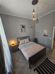 a bedroom with a large bed in a room at ZIG ZAG apartment 4- Old Town in Constanţa
