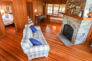 a living room with two couches and a fireplace at Steps to Nauset Beach Private Yard in Orleans