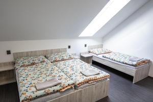 Voodi või voodid majutusasutuse Penzion Fann toas