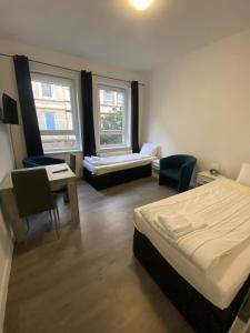 Ένα ή περισσότερα κρεβάτια σε δωμάτιο στο Modernes Apartment mit 2 Schlafzimmern und Privatparkplatz nahe Innenstadt