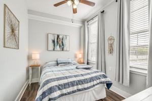 a bedroom with a bed and a ceiling fan at Pet-Friendly Galveston Getaway about 1 Mi to Beach! in Galveston