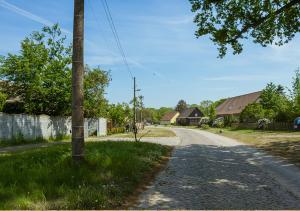 an empty road in a village with a house at Firmen-Familien-Villa in Heiligengrabe