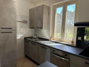 a kitchen with a sink and a window at Villa Zoë in Torre dell'Orso +30 photos