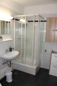 a bathroom with a shower and a sink at Ferienwohnung Ostseeperle S152 in Brasilien