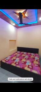 Katil atau katil-katil dalam bilik di Shri KrishanMohini Home Stay