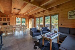 a living room with a couch and a table at Willa Górski Raj - 4 sypialnie, 2 łazienki, sauna, tradycyjna balia in Korbielów