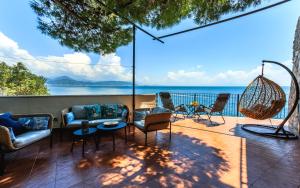 a patio with a view of the ocean at Villa Venere - Amalfi Coast in Cetara