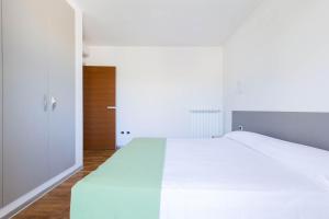 Posteľ alebo postele v izbe v ubytovaní Appartamento dell'Aurora by Le Dune Villas