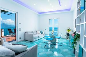 a living room with a couch and a table at Villa Venere - Amalfi Coast in Cetara