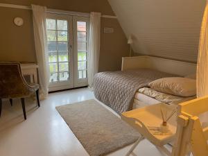 Postel nebo postele na pokoji v ubytování Sofie's Hus - Munkgaard