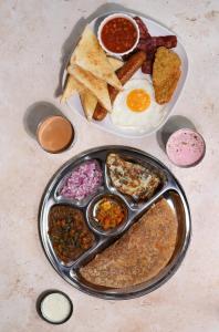 a plate of breakfast food with eggs and other foods at Abbey Hotel in Leicester