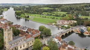 an aerial view of a town next to a river at The Henley Retreat in Henley on Thames