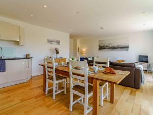 a kitchen and living room with a table and chairs at 2 bed in Tenby 88738 in Tenby