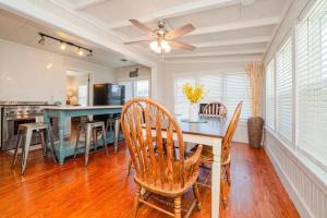 a kitchen and dining room with a table and chairs at The Cottage - Downtown Rockport in Rockport