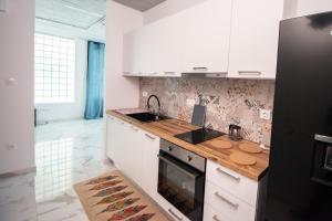 O bucătărie sau chicinetă la Kolonaki modern flat 1 bedroom 2 pers by MPS